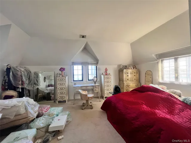 a bed room with a bed and a couch