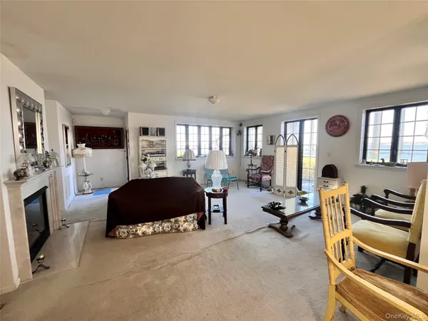 a bedroom with furniture and a window