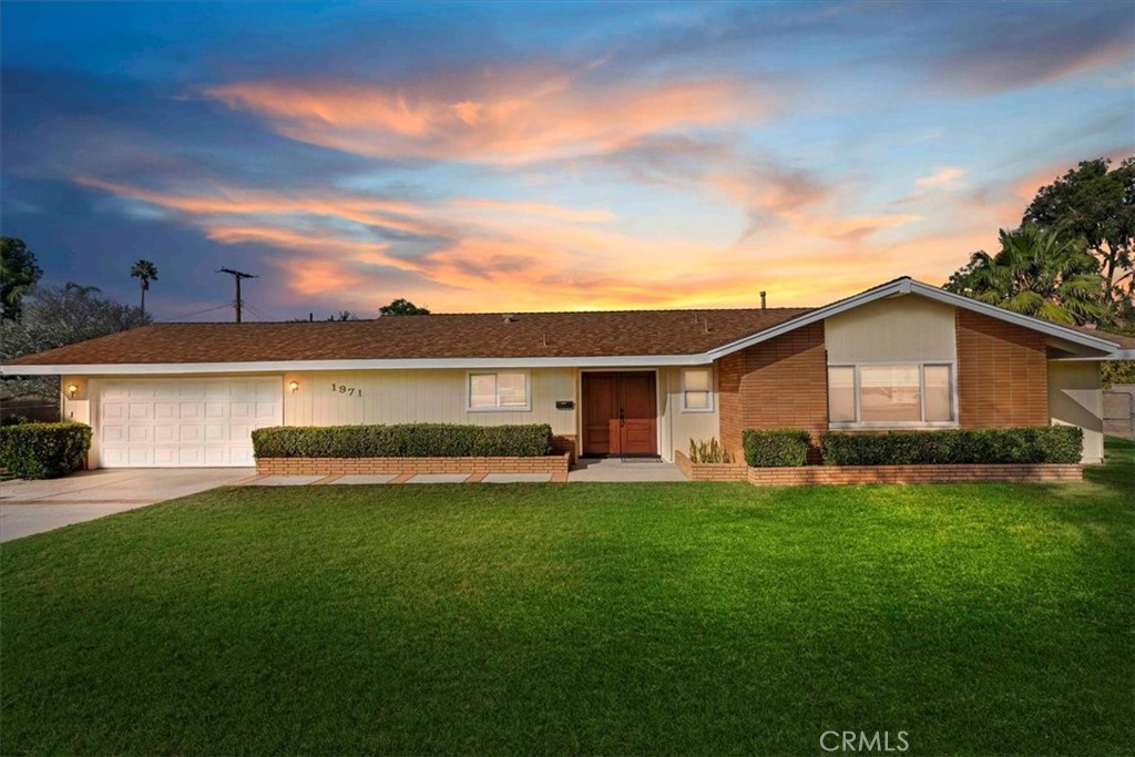 1971 Camden Street Riverside, CA 92506 - Photo 1 of 1 a view of a house with a yard and sitting area