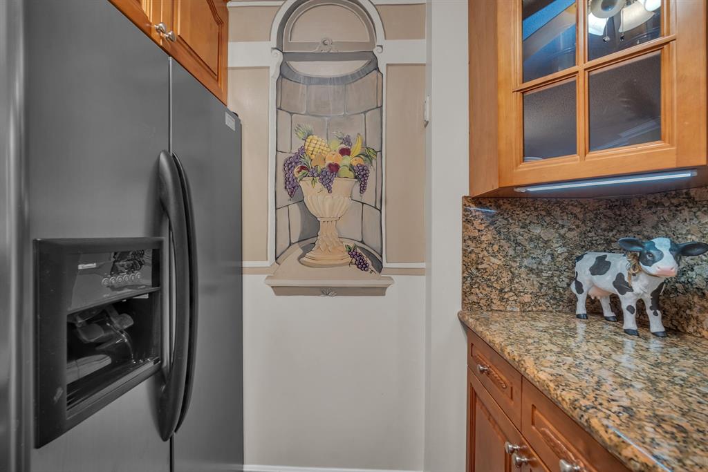 630 South Sapodilla Avenue, Unit 407 West Palm Beach, FL 33401 - Photo 12 of 25 a bathroom with a granite countertop sink a mirror and shower