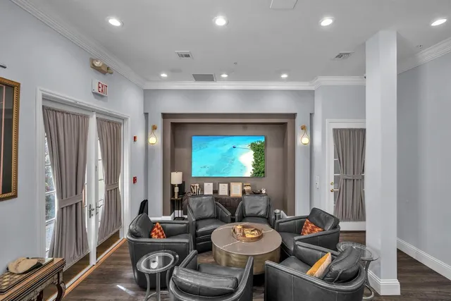 a room with furniture and a flat screen tv