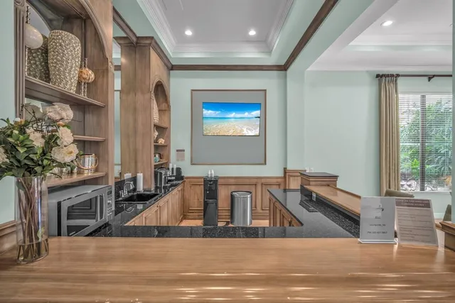 a view of a living room and kitchen