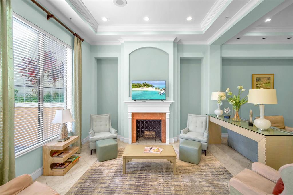 630 South Sapodilla Avenue, Unit 407 West Palm Beach, FL 33401 - Photo 24 of 25 a living room with furniture and a fireplace