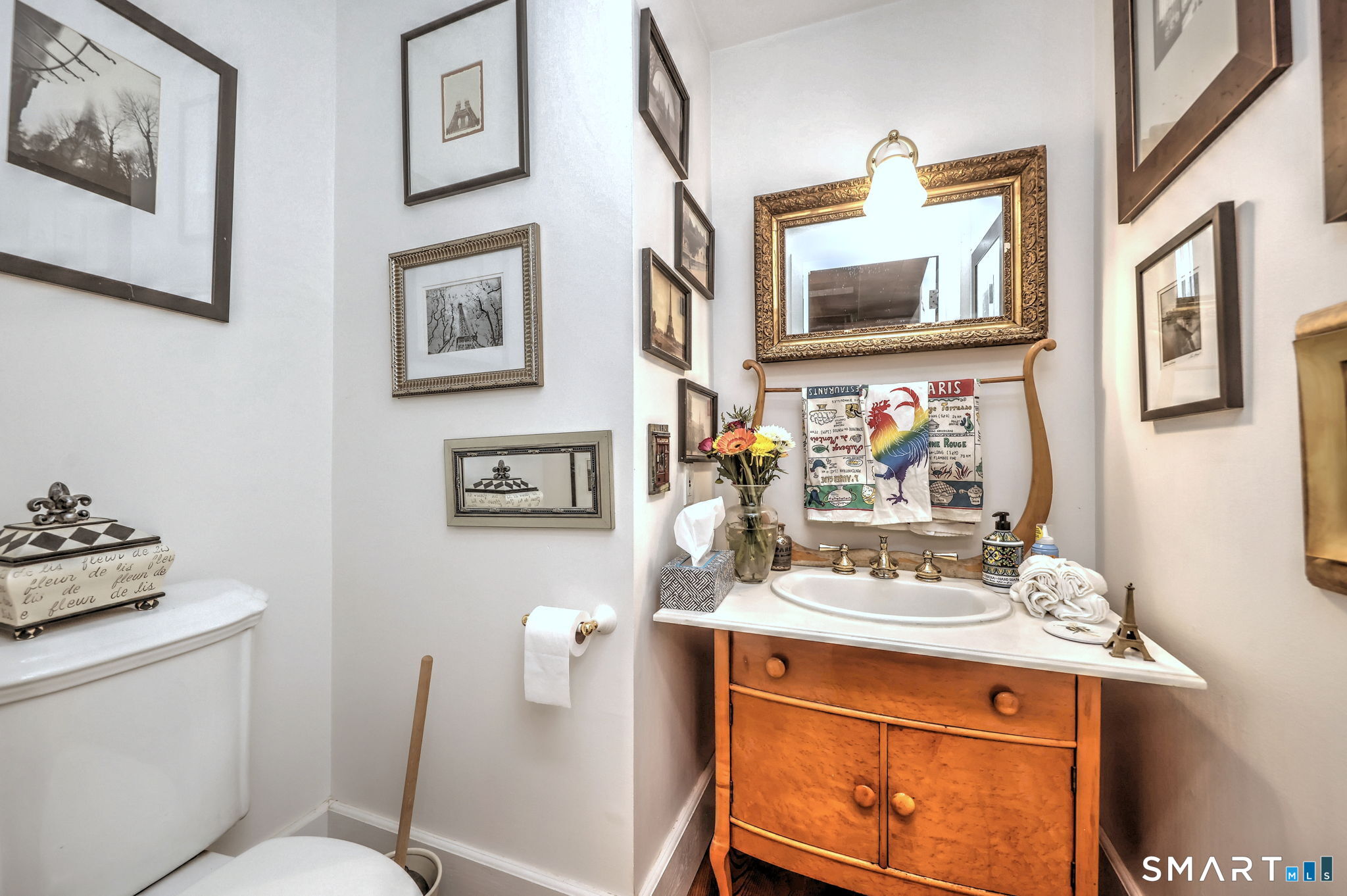 25 Center Road Woodbridge, CT 06525 - Photo 13 of 34 a bathroom with a sink mirror and toilet
