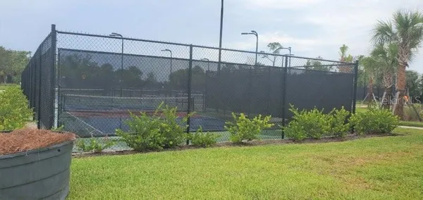 a kitchen with stainless steel appliances granite countertop a stove a sink a microwave a refrigerator a counter space and cabinets