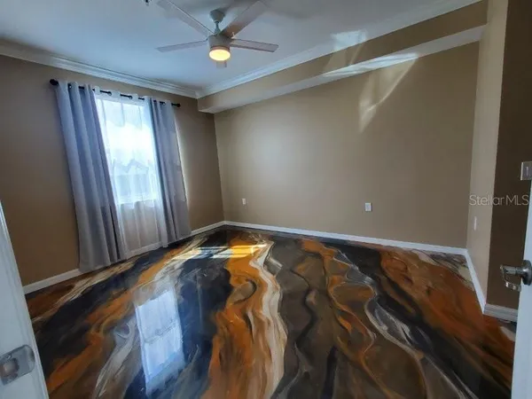 a view of a room with wooden floor