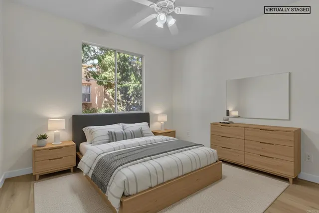 a bedroom with a bed and a dresser