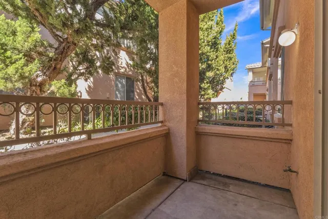 a kitchen with white cabinets and chandelier