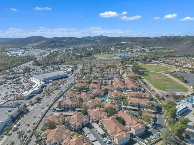 a view of a city with mountains in the background