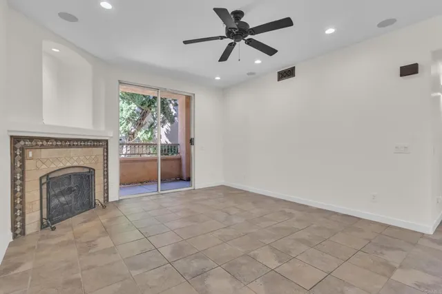 a view of a livingroom with a ceiling fan and window