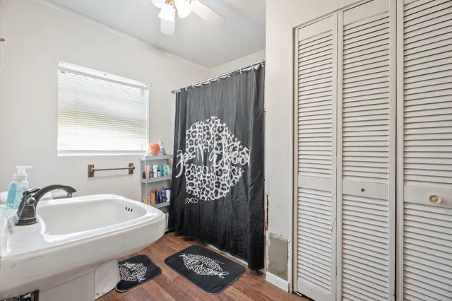 a bathroom with a bathtub and a shower