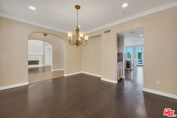 a kitchen with stainless steel appliances granite countertop a stove and a refrigerator