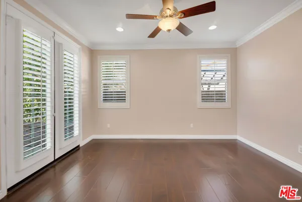 a view of a porch with a floor to ceiling window and outside view