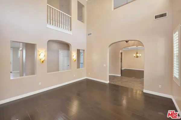 a view of a living room and kitchen with a large window