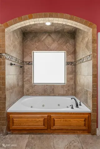 a bathroom with a glass shower door