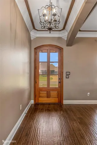 a view of wooden floor and brick walls