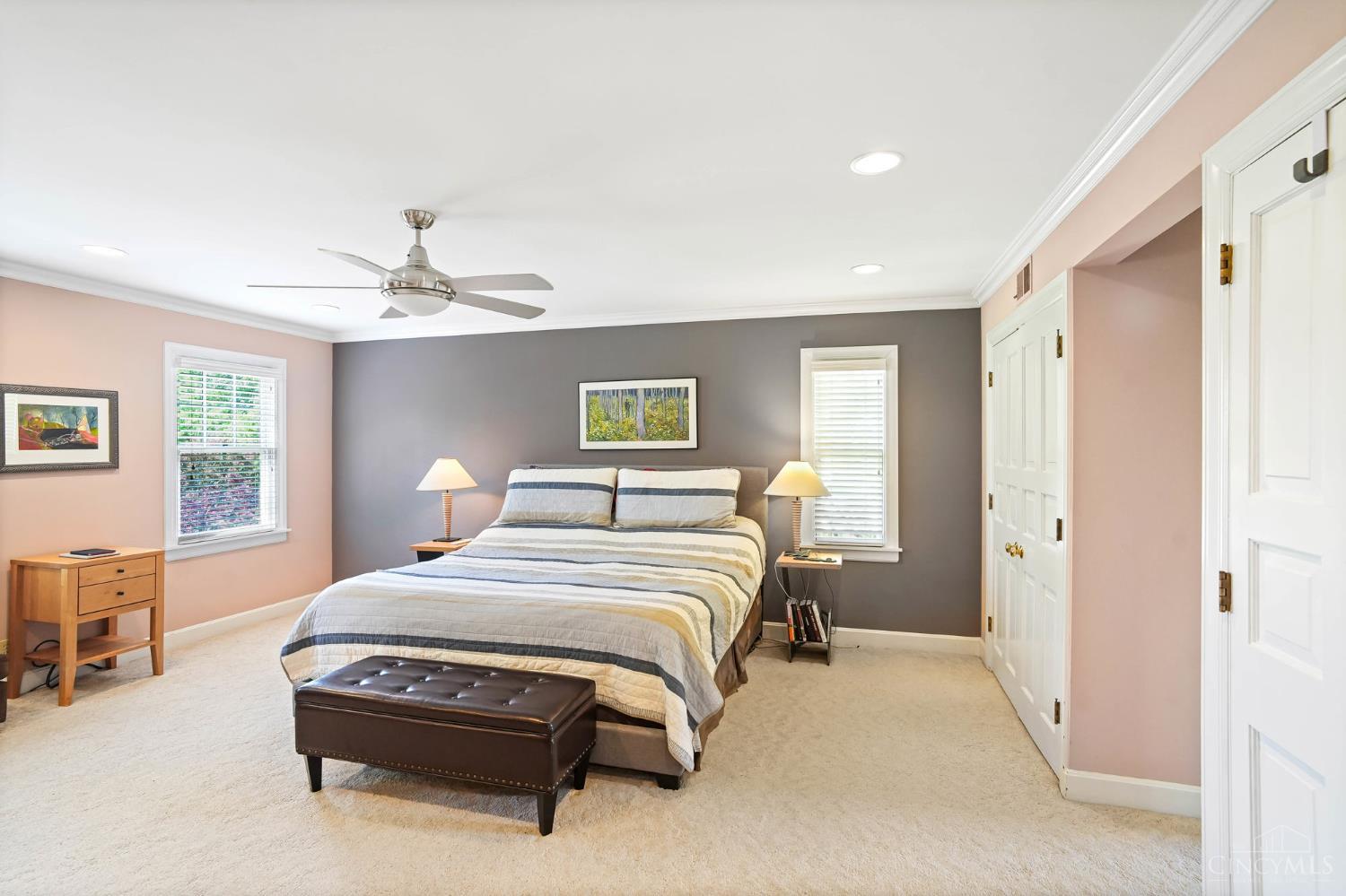 2780 Walsh Road Cincinnati, OH 45208 - Photo 25 of 68 The spacious primary suite serves as a true retreat, offering generous proportions, soft natural light, and a calming, neutral palette. The bedroom easily accommodates full furnishings with room to spare, creating an inviting and restful atmosphere. An adjoining sitting room provides the perfect flex space for a home office, reading nook, or private lounge, while the expansive walk-in closet delivers exceptional storage and organization. The suite is further complemented by an ensuite bath, completing this comfortable and well-appointed primary sanctuary.
