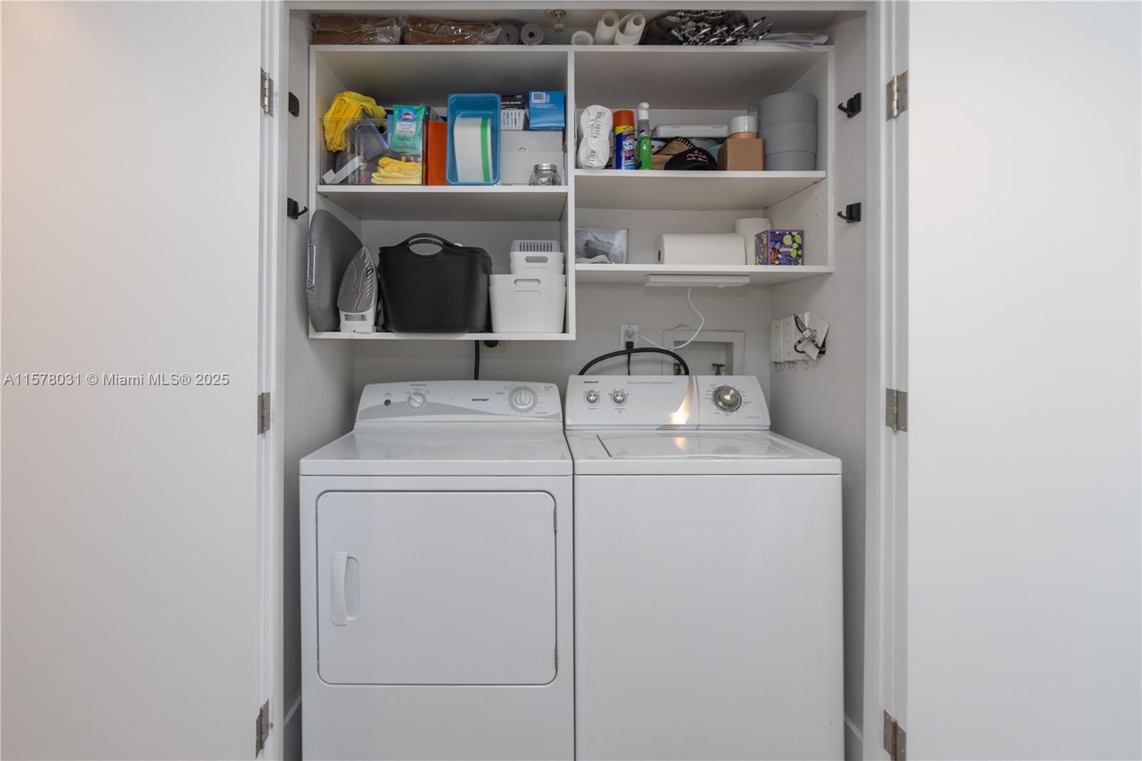 90 Alton Road, Unit 1411 Miami Beach, FL 33139 - Photo 19 of 36 a utility room with dryer and washer
