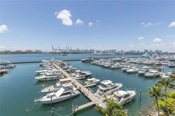 a view of a ocean with boats and water view