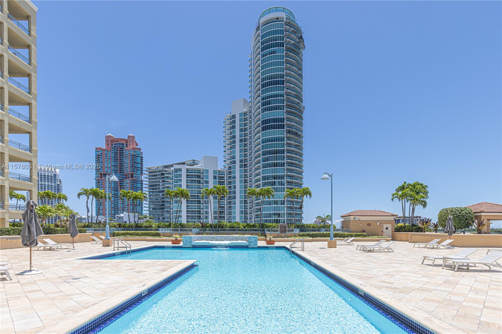 90 Alton Road, Unit 1411 Miami Beach, FL 33139 - Photo 25 of 36 a view of swimming pool with outdoor seating