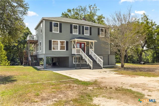 a view of a house with snow on the roof