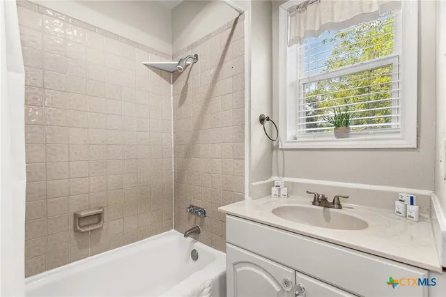 a bathroom with a sink and a tub