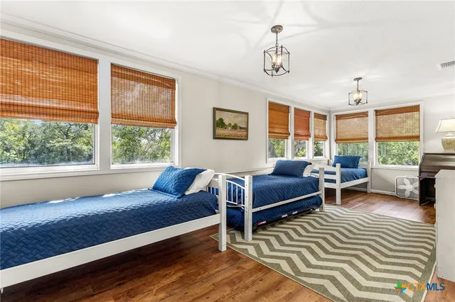 a bedroom with furniture and a window