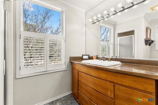 a view of bathroom with dual sinks