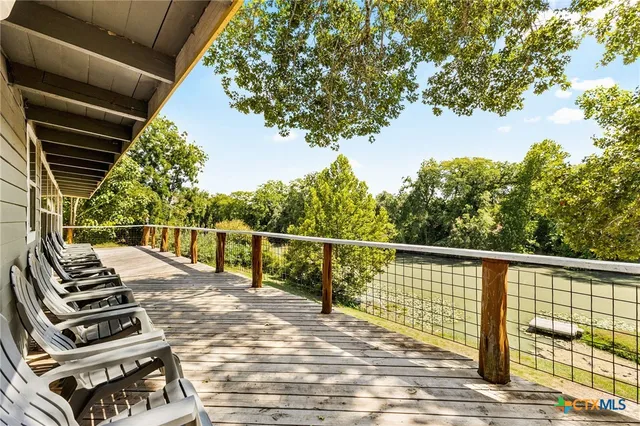 a view of balcony with wooden floor