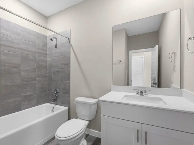 a bathroom with a sink a toilet and a bathtub