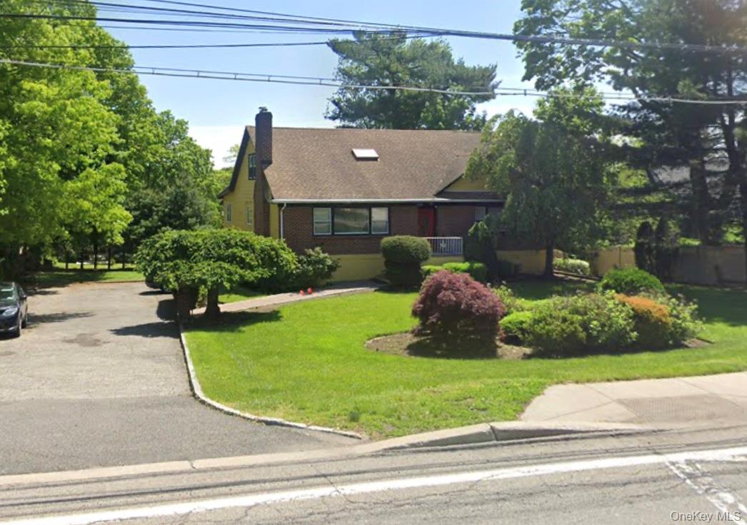 169 Old Mamaroneck Road, Unit B1 White Plains, NY 10605 - Photo 11 of 11 a view of a house with a yard