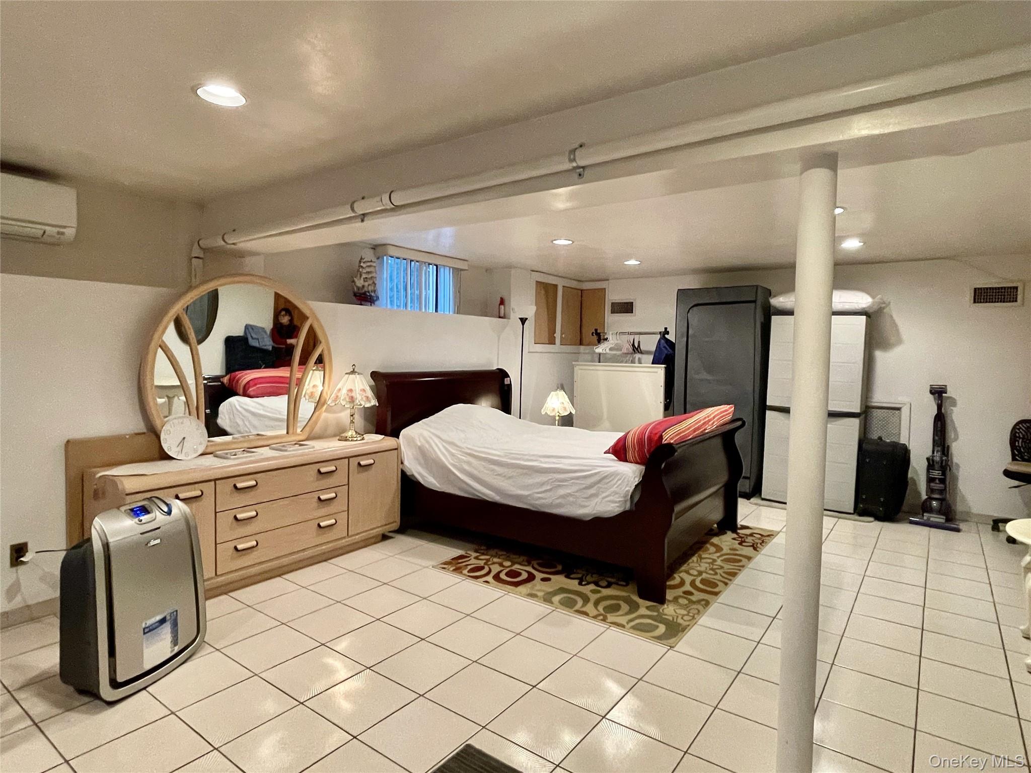 169 Old Mamaroneck Road, Unit B1 White Plains, NY 10605 - Photo 3 of 11 a spacious bedroom with a bed and a cabinets