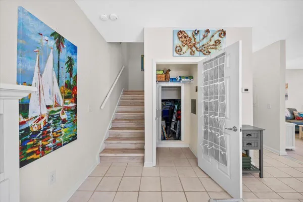 a view of a hallway with front door and furniture