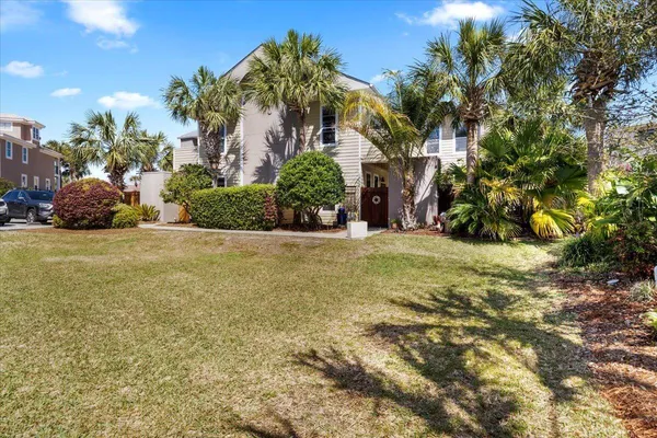 a view of a tree in front of a house