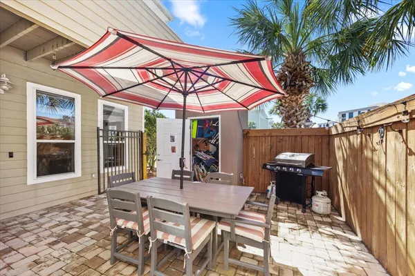 a patio with table and chairs