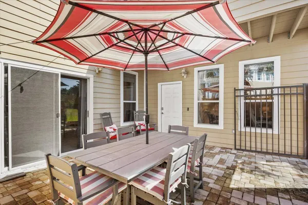 a patio with a table and chairs