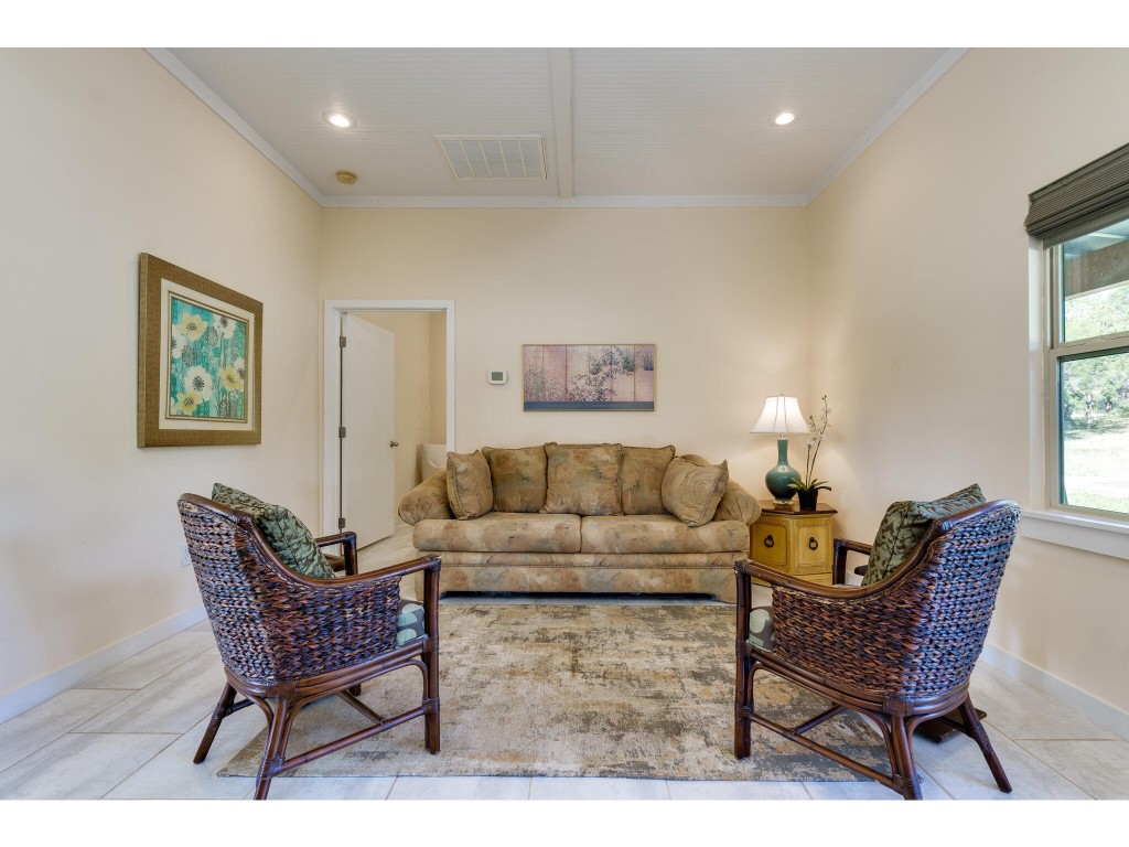 250 Caliche Road Wimberley, TX 78676 - Photo 11 of 40 a living room with furniture and a window