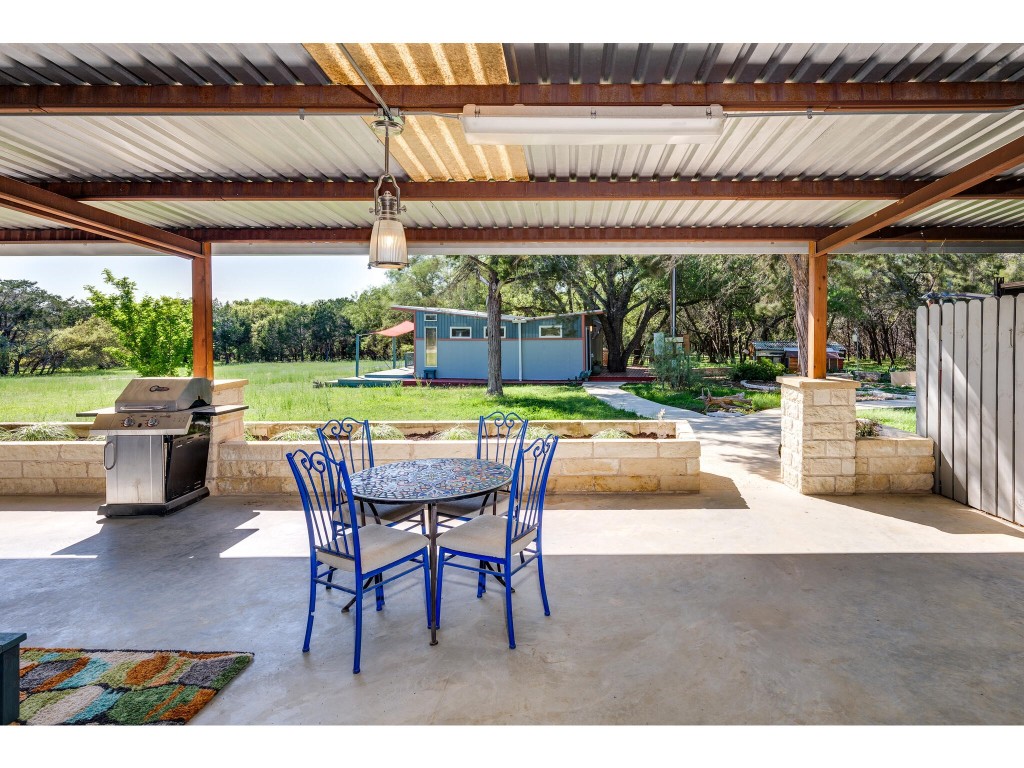 250 Caliche Road Wimberley, TX 78676 - Photo 12 of 40 a patio with garden area and patio