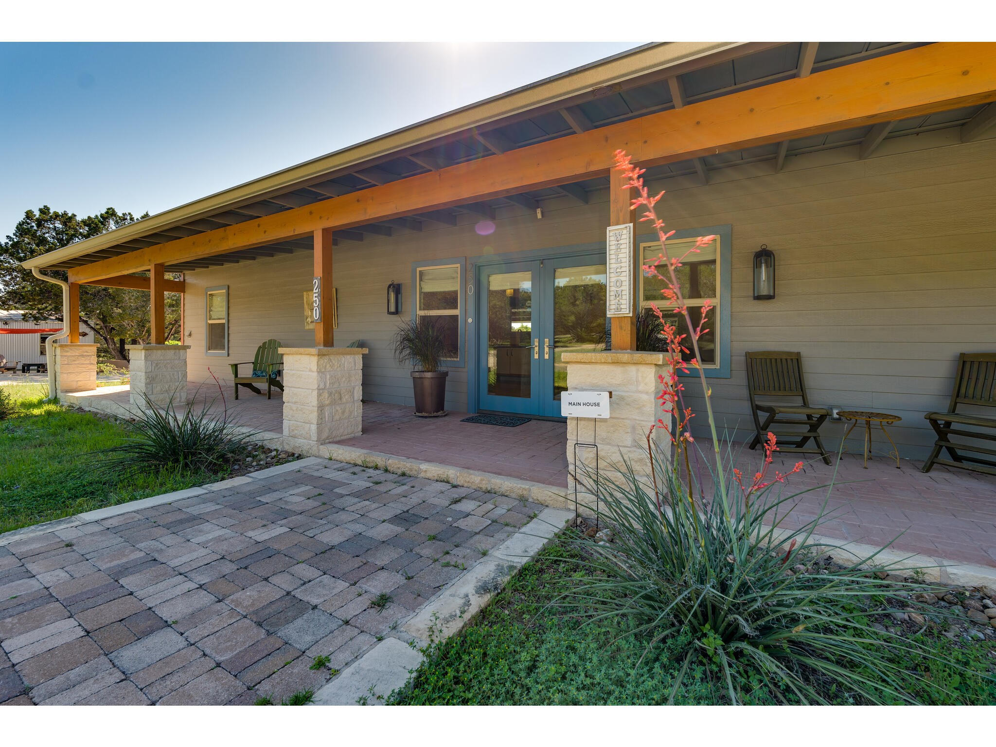 250 Caliche Road Wimberley, TX 78676 - Photo 2 of 40 a view of a house with backyard