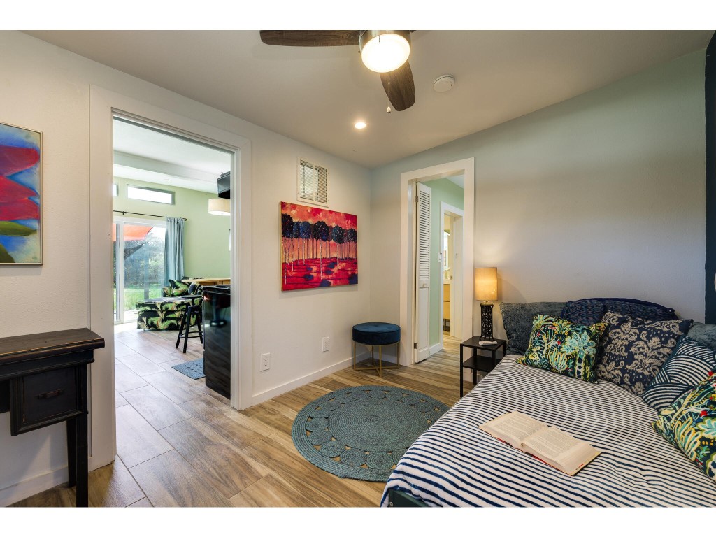 250 Caliche Road Wimberley, TX 78676 - Photo 25 of 40 a bedroom with a bed and a table