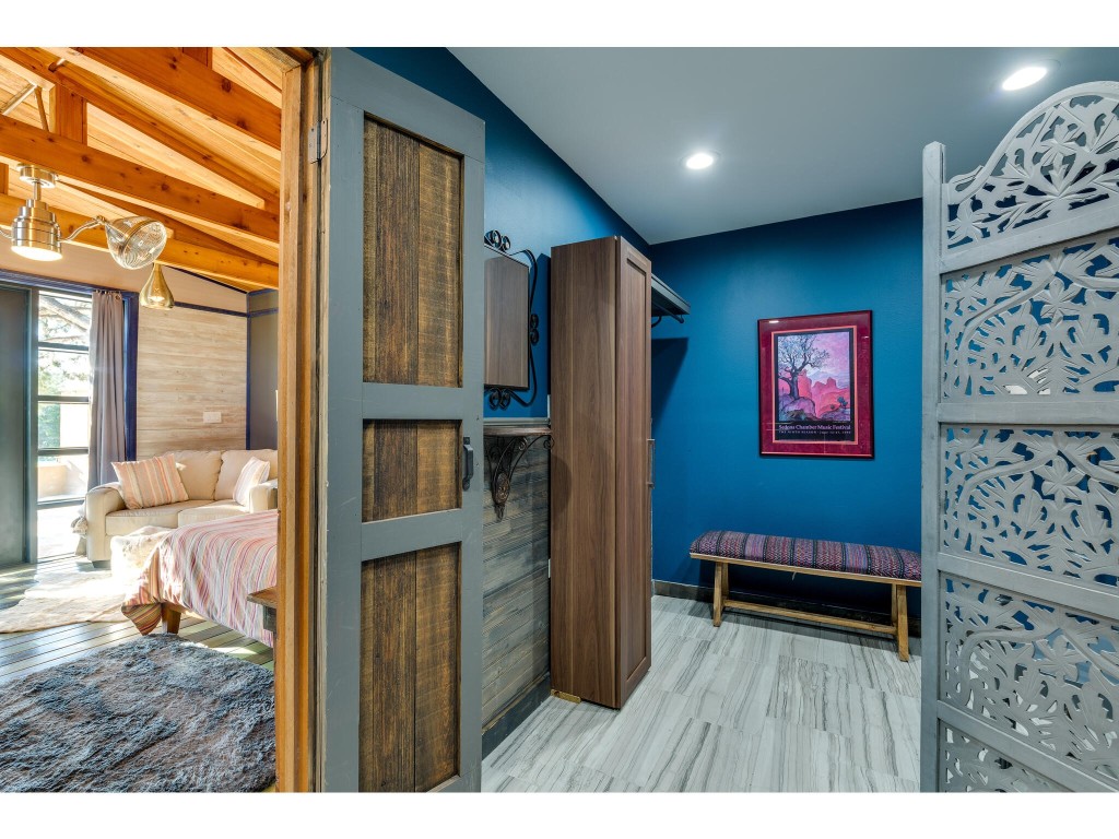 250 Caliche Road Wimberley, TX 78676 - Photo 33 of 40 a room with furniture and a window