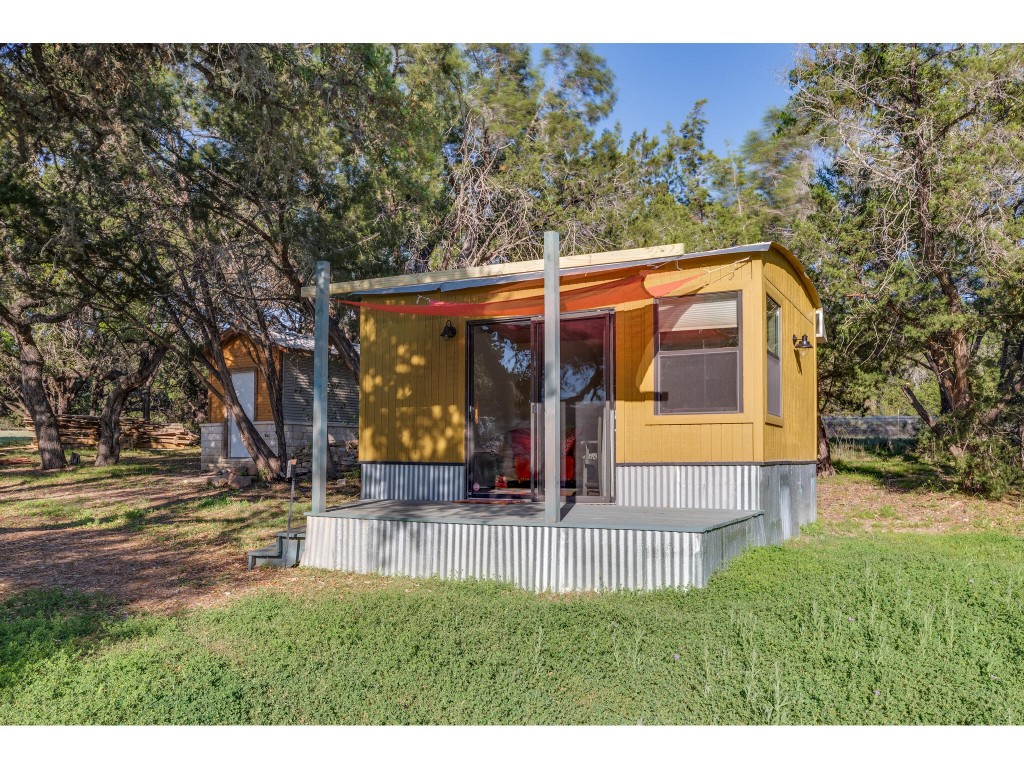 250 Caliche Road Wimberley, TX 78676 - Photo 39 of 40 a view of a house with a yard