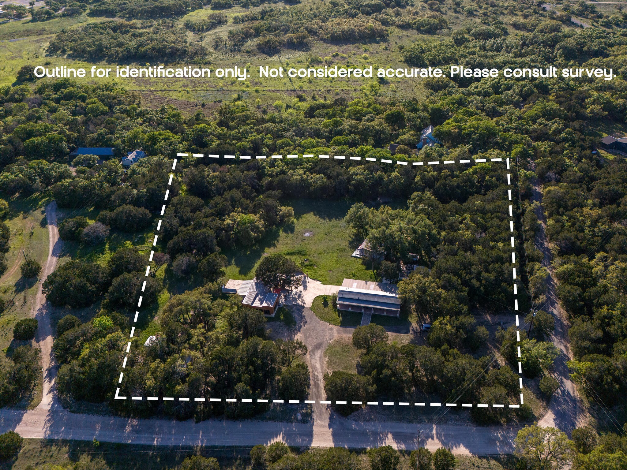 250 Caliche Road Wimberley, TX 78676 - Photo 4 of 40 an aerial view of residential houses with outdoor space and swimming pool