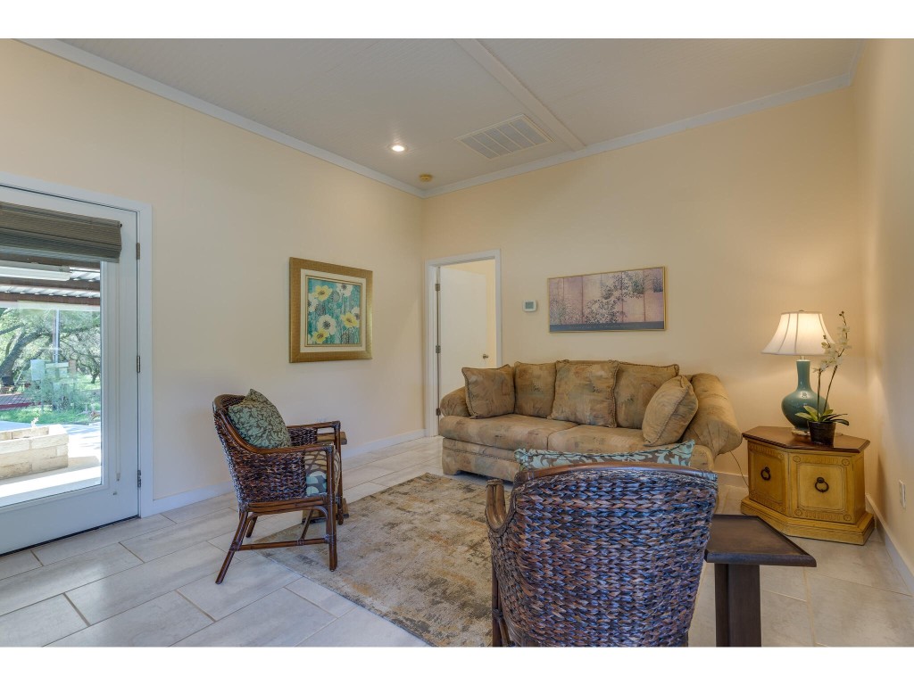 250 Caliche Road Wimberley, TX 78676 - Photo 5 of 40 a living room with furniture and a window