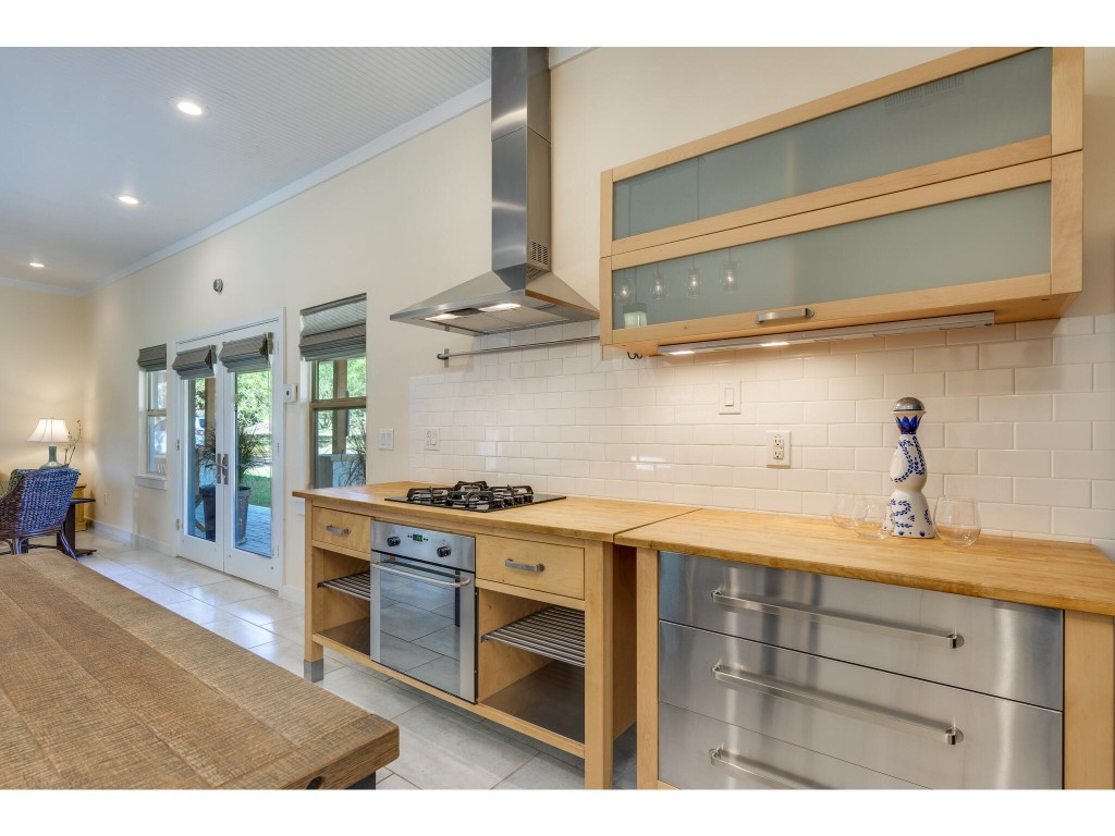 250 Caliche Road Wimberley, TX 78676 - Photo 8 of 40 a kitchen with a stove and a sink