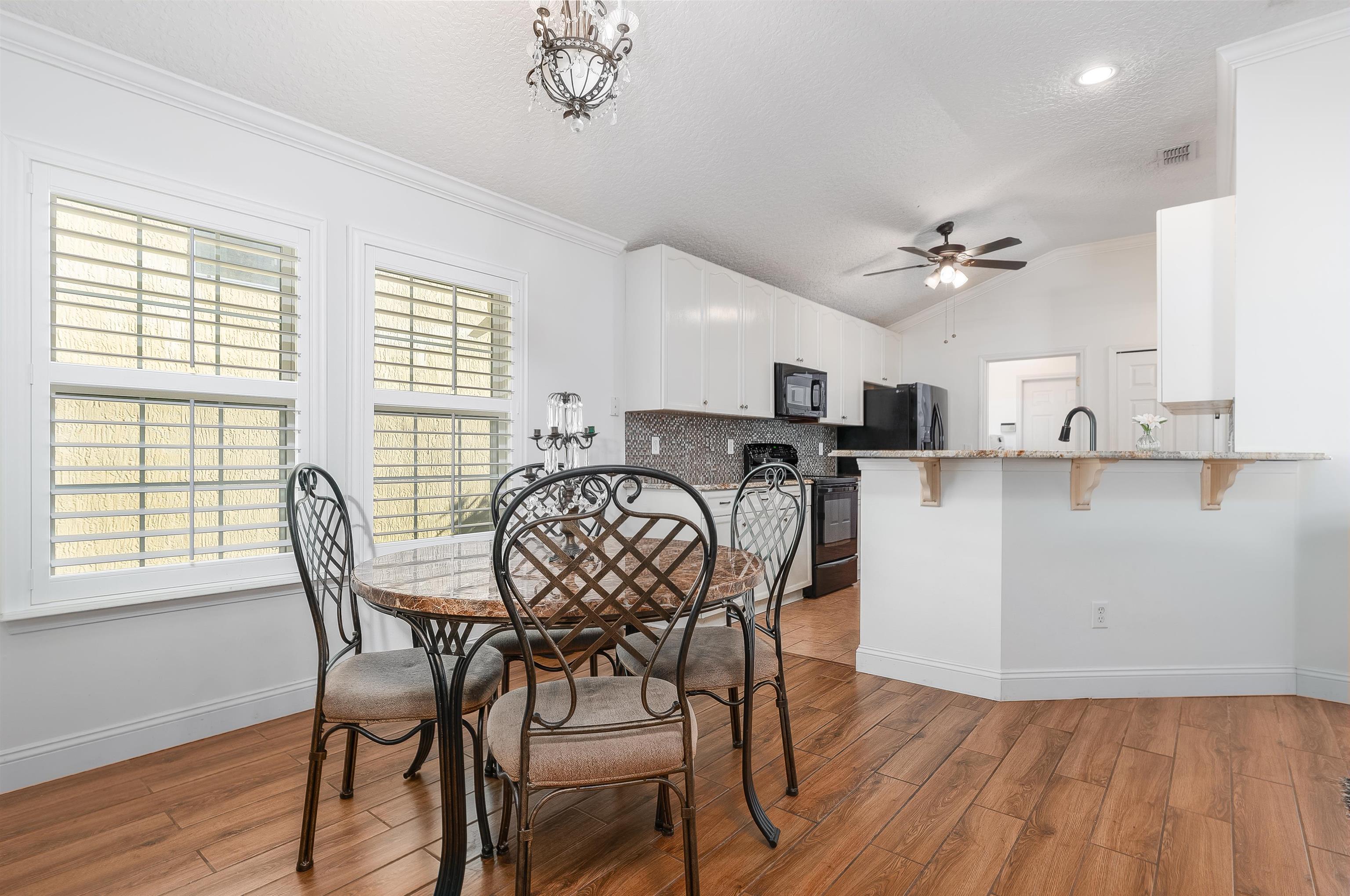 1236 Splendid Ravine Street St. Augustine, FL 32092 - Photo 20 of 47 a view of a dining room with furniture and wooden floor