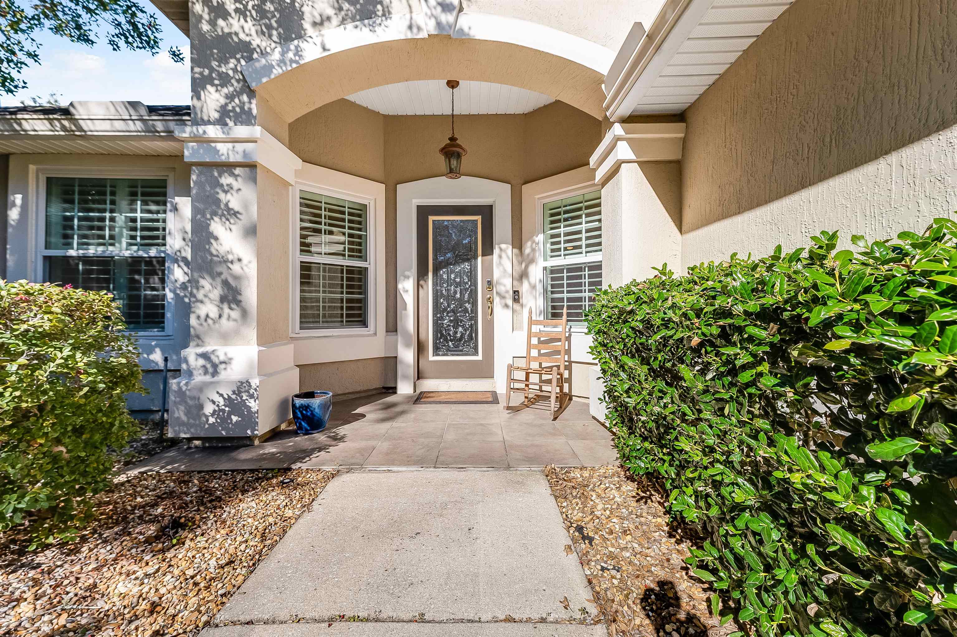 1236 Splendid Ravine Street St. Augustine, FL 32092 - Photo 2 of 47 a front view of a house with a yard