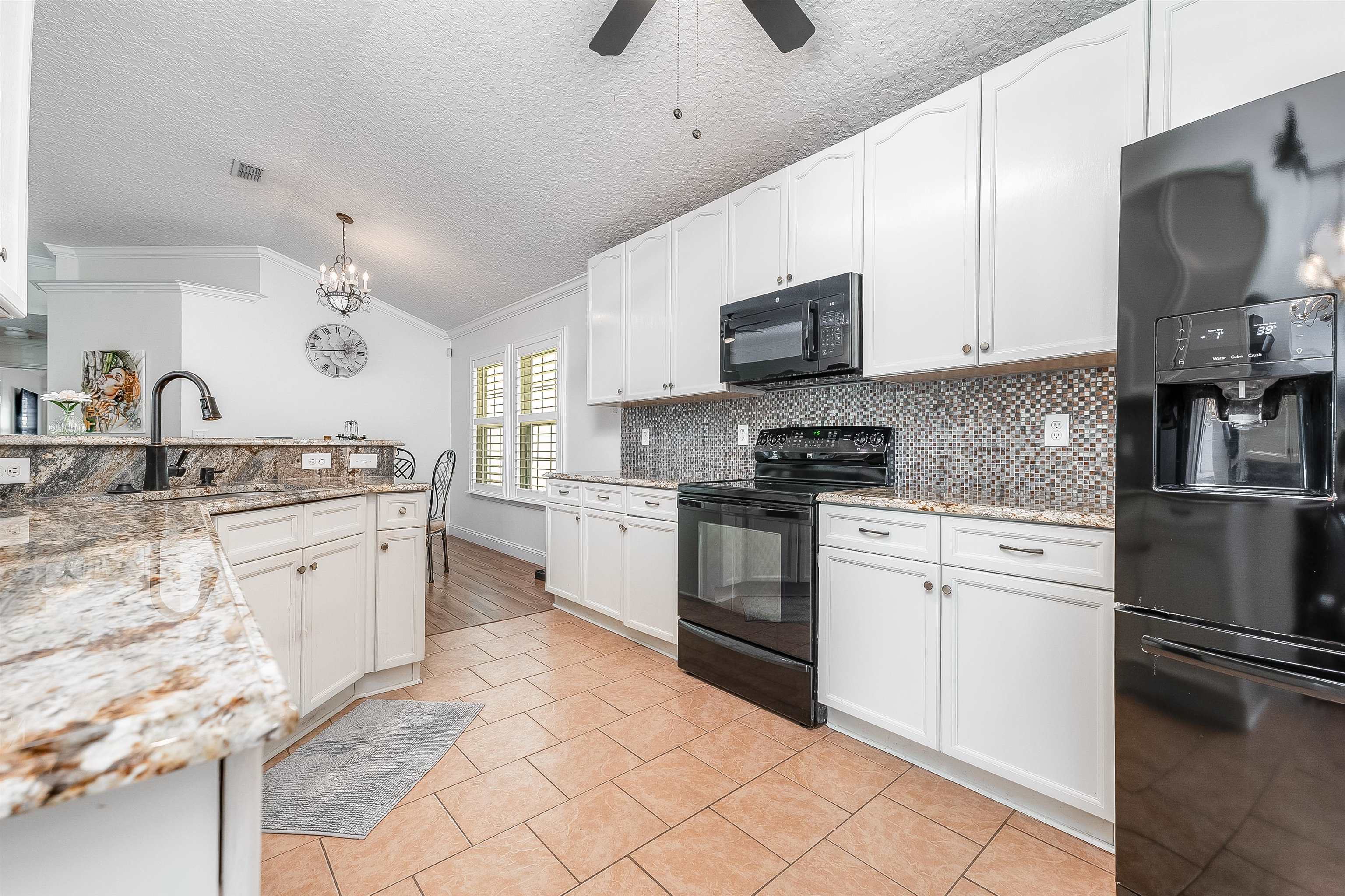 1236 Splendid Ravine Street St. Augustine, FL 32092 - Photo 22 of 47 a kitchen with granite countertop a sink stainless steel appliances and cabinets