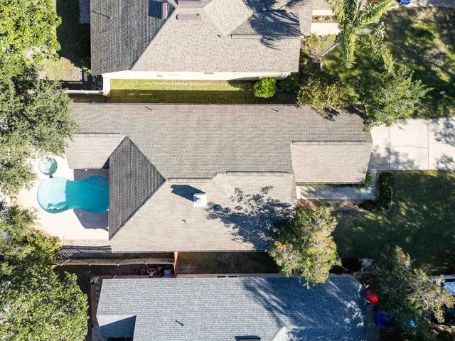 a view of house with a yard