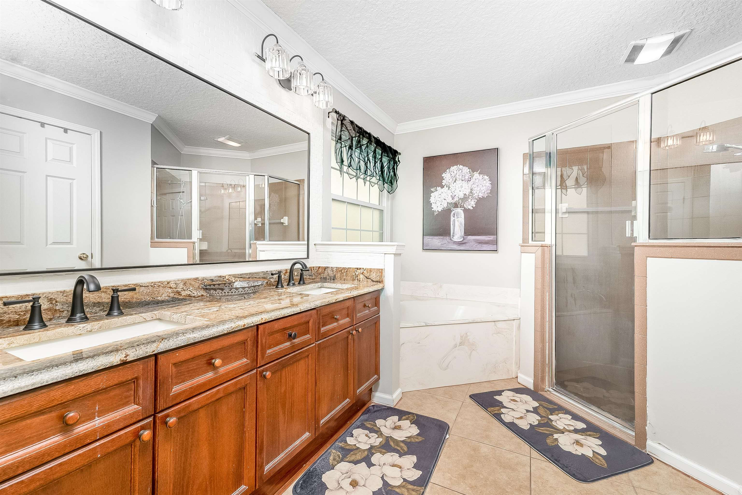 1236 Splendid Ravine Street St. Augustine, FL 32092 - Photo 30 of 47 a bathroom with a sink a mirror and a shower